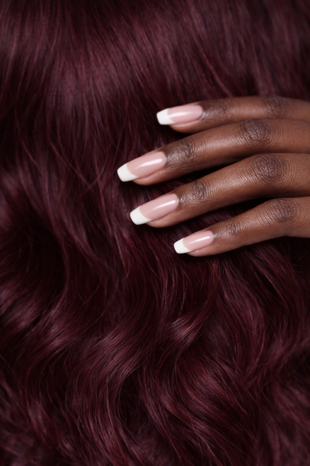 Luxury burgundy red wine human hair wig texture close-up showing silky movement, rich colour depth and premium finish